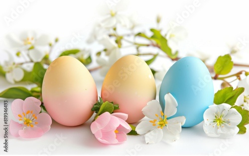 Easter eggs and spring flowers on a crisp white background.