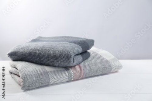 Stylish soft scarfs on white wooden table © New Africa