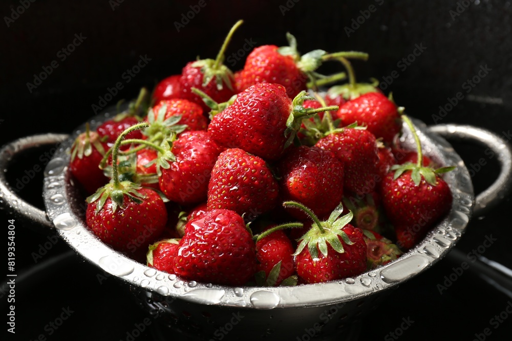 Metal colander with fresh wet strawberries in sink, closeup Metal colander with fresh wet strawberries in sink, closeup