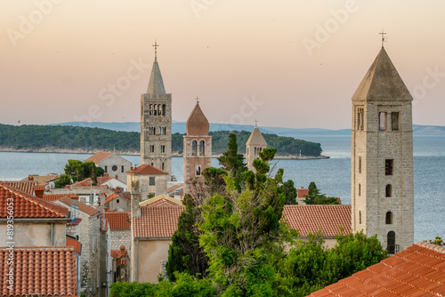 Fototapeta Naklejka Na Ścianę i Meble -  HIstoric towers of a Rab town on Rab island at sunrise, Croatia.