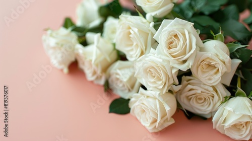 Top view  very beautiful white roses arranged in an arrangement. right edge of image on a light pink background wedding invitation card special day