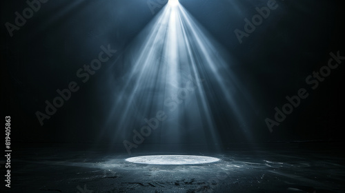 Black background illuminated by a single  powerful spotlight in the center