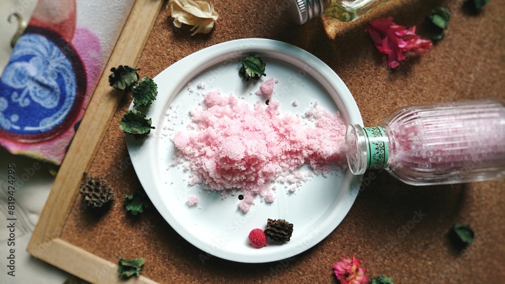 Composition of spa products, pink sea salt in a white plate on a wooden background. Composition of spa products, pink sea salt in a white plate on a wooden background.