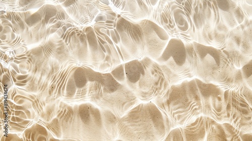 Abstract beige sand and water background with detailed ripples and patterns.