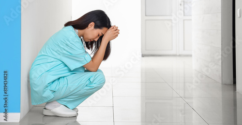 Stressed female Asian medic...