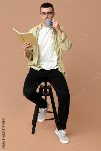 Handsome young man sitting ...