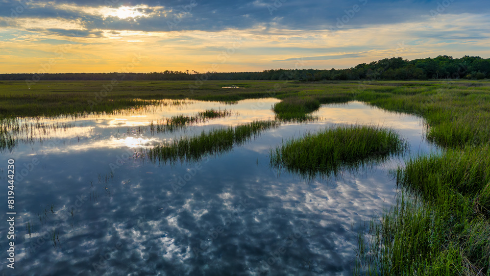 Fototapeta premium Aerial reflection at sunset low country marsh