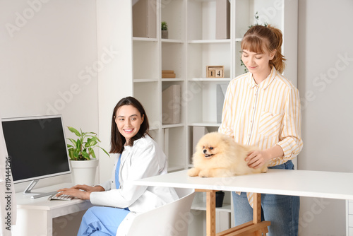 Veterinarian working on com...