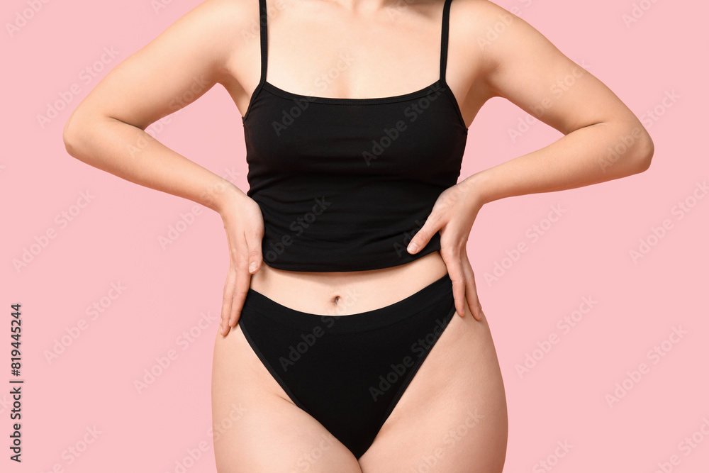 Body positive young woman in underwear on pink background, closeup Body positive young woman in underwear on pink background, closeup