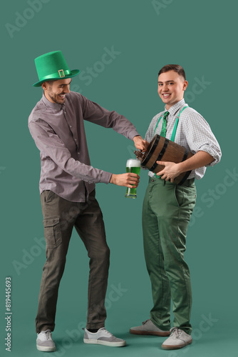 Male friends pouring beer f...