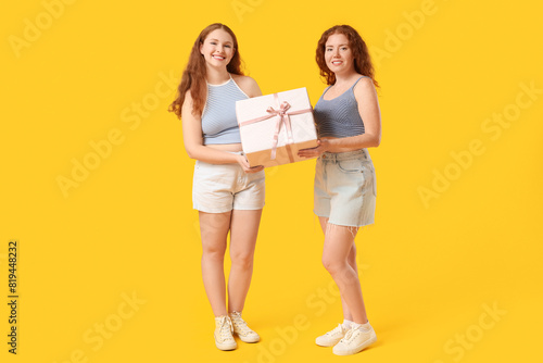 Happy redhead sisters with ...