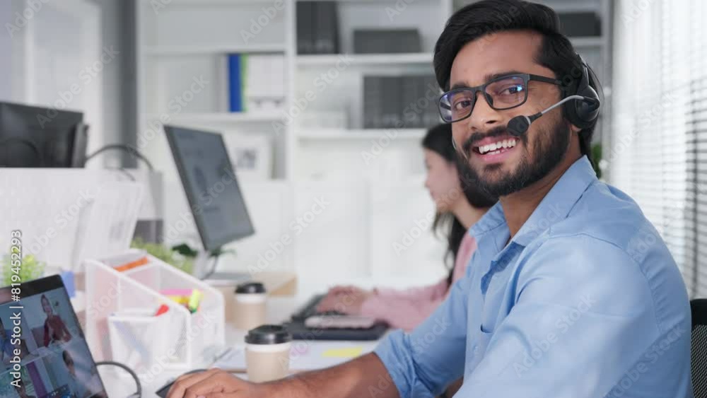 Closeup face of indian or arabian man wearing headset and talking, business advisor, call center worker, company representative, support service operator, holds online consultation Closeup face of indian or arabian man wearing headset and talking, business advisor, call center worker, company representative, support service operator, holds online consultation