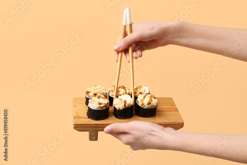 Hands holding wooden board ...