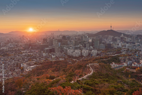 High angle view of Namsan Seoul Tower surrounded by cityscape of Seoul with sunlights in the morning, Seoul, South Korea