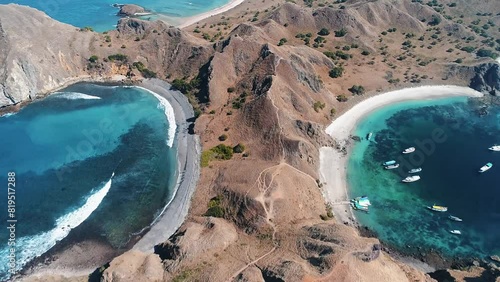 Padar Komodo Island Aerial Panorama. Travel destination. Nature background. Beautiful wild landscape. Exotic summer holiday. Travel, outdoor tourism, vacation. Cinematic drone flight Flores, photo