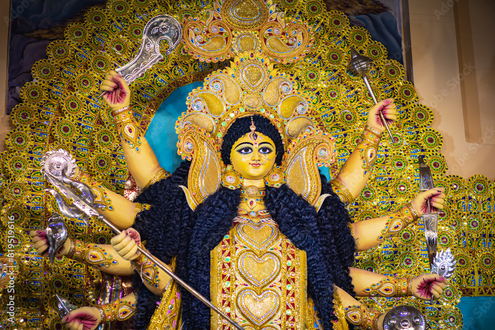 Obraz premium goddess Durga idol during Durga puja festival in India. It is very popular hindu religious festival. Deity is worshipped as symbol of power and women empowerment.
