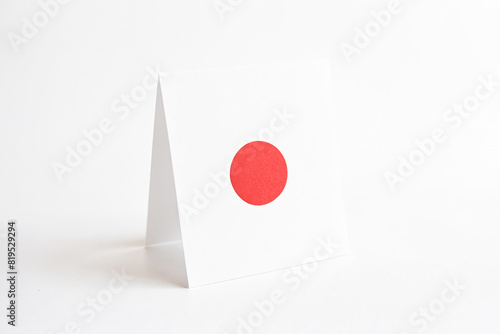 Free Download Folded Piece of Paper with a Red Circle on White Background - GFXLoad