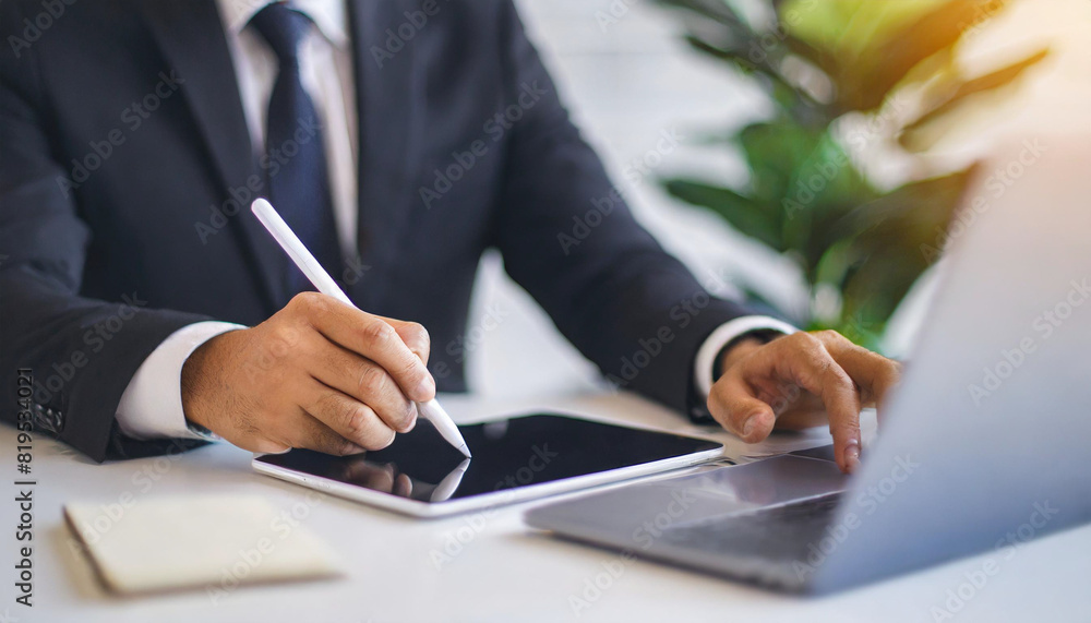 Businessman's hand in black suit using a stylus pen to sign an e-document on a digital device, highlighting modern technology in business, efficiency, and the shift towards paperless transactions Businessman's hand in black suit using a stylus pen to sign an e-document on a digital device, highlighting modern technology in business, efficiency, and the shift towards paperless transactions