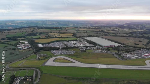 Aerial footage of the famous Leeds and Bradford airport located in the Yeadon area of West Yorkshire in the UK, typical British airport showing the runway and houses and roads around the airport photo