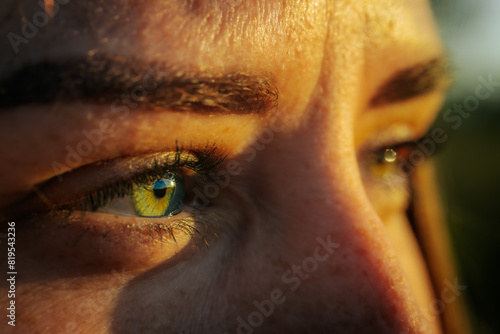 Vászonkép An intense close-up of a person's eyes reflecting a natural landscape