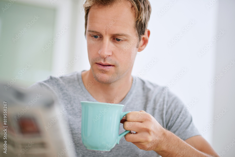 Man, serious and newspaper in morning with coffee for breaking news or announcement in global press. Story, article and report or problem with print media, crisis and newsletter in London apartment. Man, serious and newspaper in morning with coffee for breaking news or announcement in global press. Story, article and report or problem with print media, crisis and newsletter in London apartment.