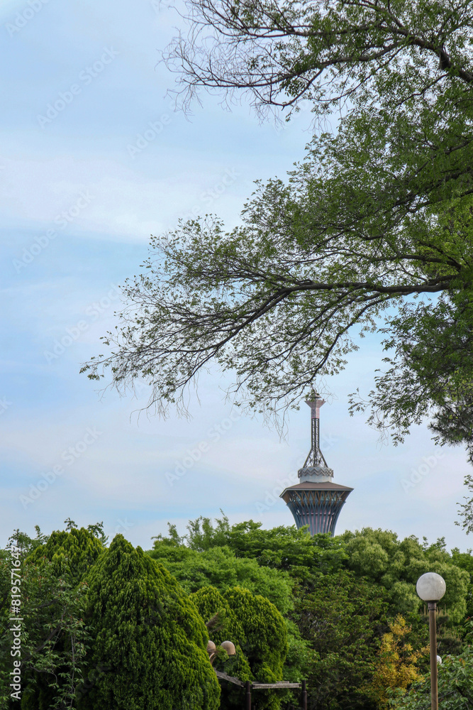 Japanese tower background with additional green leaf ornaments and clear sky Japanese tower background with additional green leaf ornaments and clear sky
