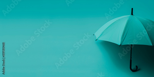 A teal umbrella on a matching teal background  symbolizing protection and insurance.  Generative AI