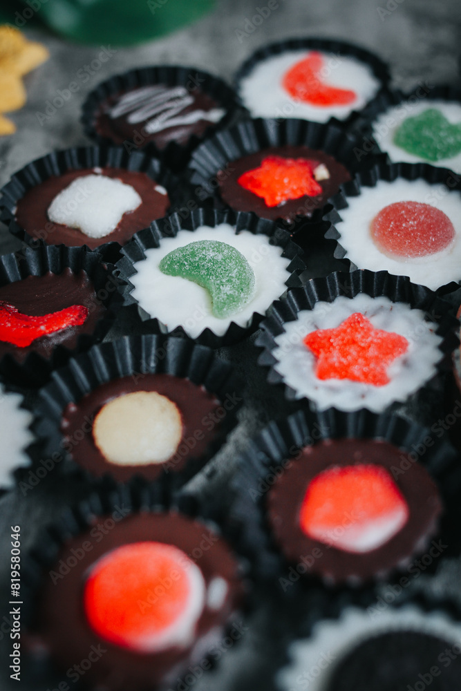 Stack of vegan chocolate cups with caramel on white tabletop. Homemade vegetarian chocolate caramel cups. Ideas and recipes for healthy sweets and dessert. Selective focus. Copy space for text. Stack of vegan chocolate cups with caramel on white tabletop. Homemade vegetarian chocolate caramel cups. Ideas and recipes for healthy sweets and dessert. Selective focus. Copy space for text.