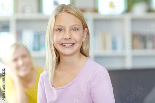 Free Download Child, portrait and smile in home with mother for relaxing bonding or weekend, development or family. Daughter, woman and happiness as elementary student in apartment together, living room or youth - GFXLoad