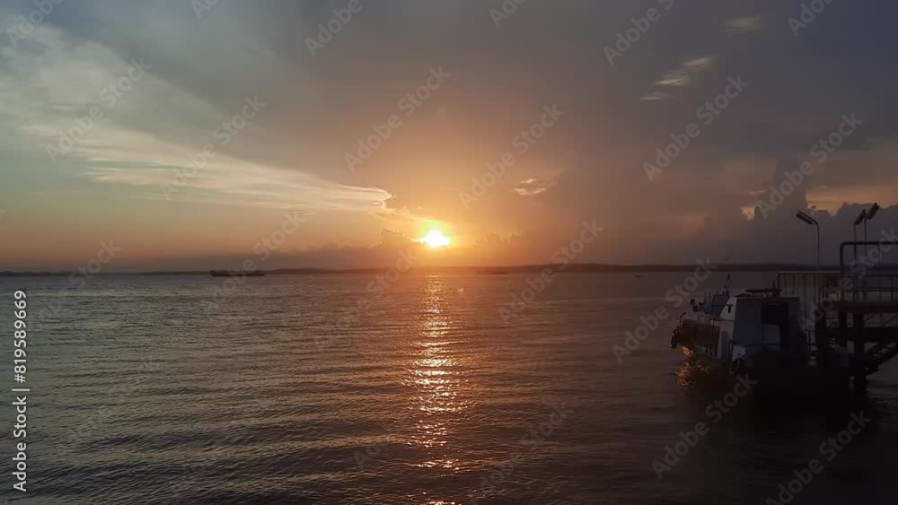Dramatic sea sunset. Burning sky and shining golden waves. Sunset sea 4k. Red sky, yellow sun and amazing sea. Summer sunset seascape. Atlantic Dramatic sea sunset. Burning sky and shining golden waves. Sunset sea 4k. Red sky, yellow sun and amazing sea. Summer sunset seascape. Atlantic