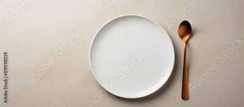 A plate with a spoon and a holder photo