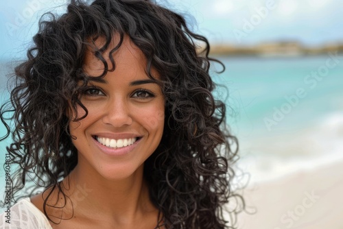 Beautiful Woman Black Hair. Portrait of Smiling Woman with Curly Black Hair at the Beach