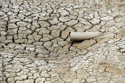Dried soil surface, waterless sewer pipes after long time hot season at Mekong Delta, Viet Nam, climate change and el nino make hard weather of global, drought field affect to food Security