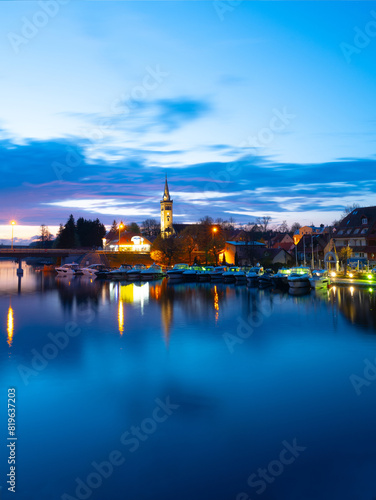 2023-04-27  panorama Mikolajskie Lake of town  marina for yachts and boats at the waterfront. Mikolajki  Poland.