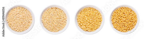 Pastina variants, Italian soup pasta, in white bowls. Uncooked tiny minute pasta, made of durum wheat semolina. From left to right stelle or stelline, alfabeto, perline or conchiglie, and gramigna. photo