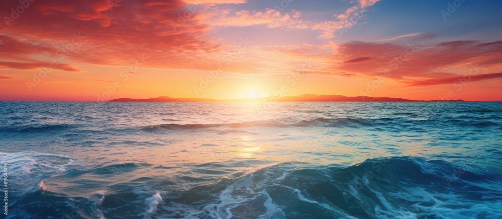 Stunning sunset over the ocean with a beautiful seascape in the background perfect for a copy space image Stunning sunset over the ocean with a beautiful seascape in the background perfect for a copy space image