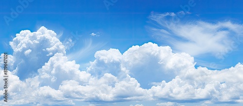 Bright blue sky with white clouds providing a natural background for copy space image
