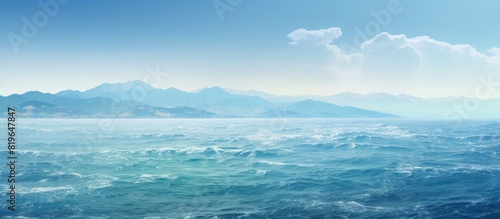 Scenic view of the sea and mountains with a copy space image © Ilgun
