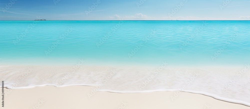 Beach with white sands and clear turquoise water perfect for a copy space image