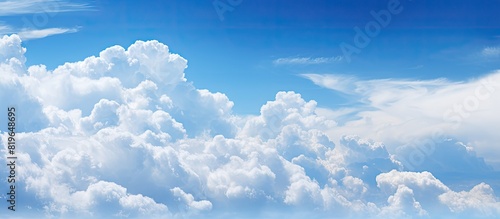 Blue sky with fluffy white clouds copy space image