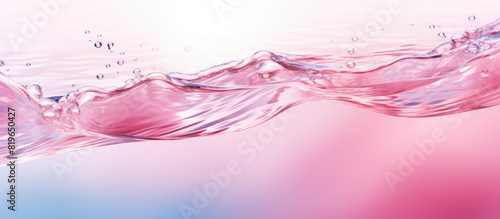 Clear pink water texture with ripples bubbles and waves in sunlight for a summer themed banner with copy space image for cosmetics like moisturizers and toners photo