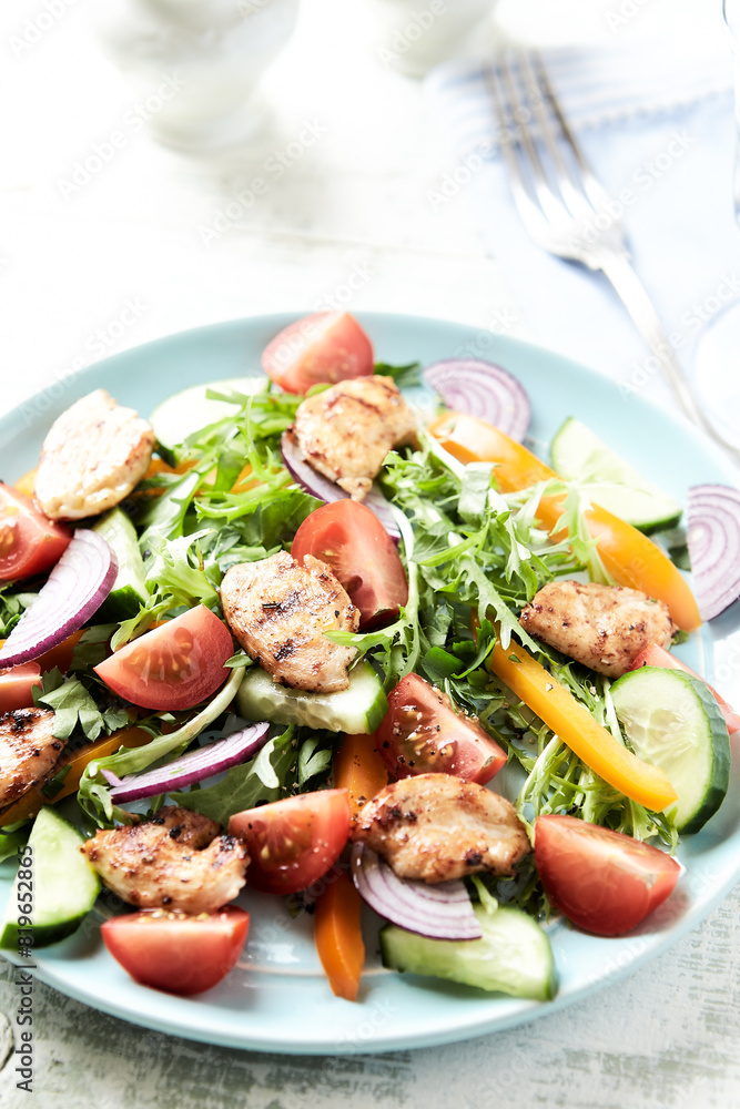Healthy Salad with Chicken Breast, Cherry Tomatoes, Cucumber, Orange Pepper, Endive and Red Onion. Close up. Healthy Salad with Chicken Breast, Cherry Tomatoes, Cucumber, Orange Pepper, Endive and Red Onion. Close up.