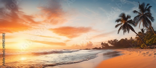Sunset on a tropical beach with an inviting atmosphere and a beautiful sky making it a perfect setting for romantic walks a serene scene with a copy space image