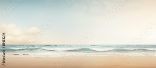 A sandy beach with the sea in the background providing a copy space image