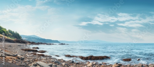 Rocky beach by the sea with a copy space image