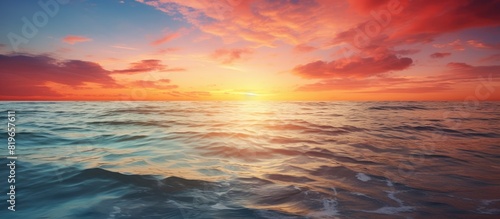 Stunning sunset over the ocean with a beautiful seascape in the background perfect for a copy space image