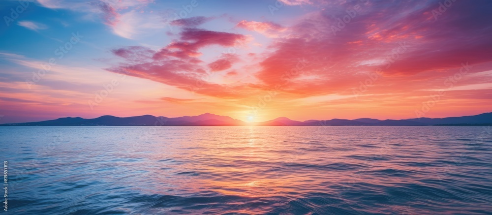 Scenic seascape with a colorful sunset over the water ideal for a copy space image
