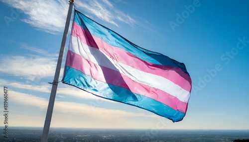 trans flag fluttering against blue sky, lgbt, pride month