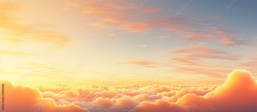Sunrise scenery with fluffy orange and yellow clouds in the early morning creating a beautiful golden hour summer background with copy space image