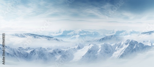 Aerial photograph showcasing stunning mountain landscapes with a vast expanse of snow covered peaks and valleys suitable for use as a copy space image